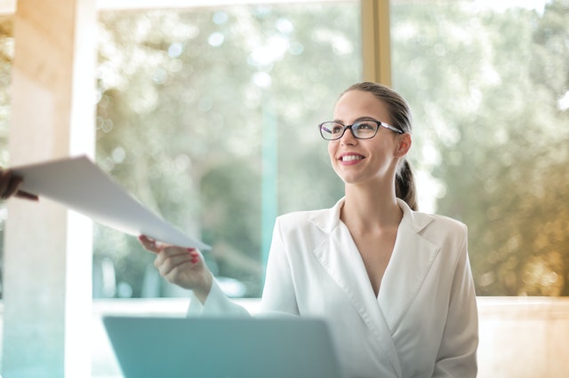 Businesswoman Holding Papers